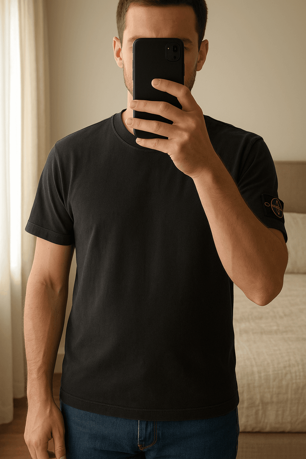 Stone Island T-shirt XL standing straight facing the camera, in a softly lit bedroom setting, with gentle natural light filtering through a window.